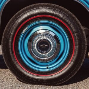 Detailed view of a classic 1966 Chevrolet Caprice wheel with distinctive blue design.