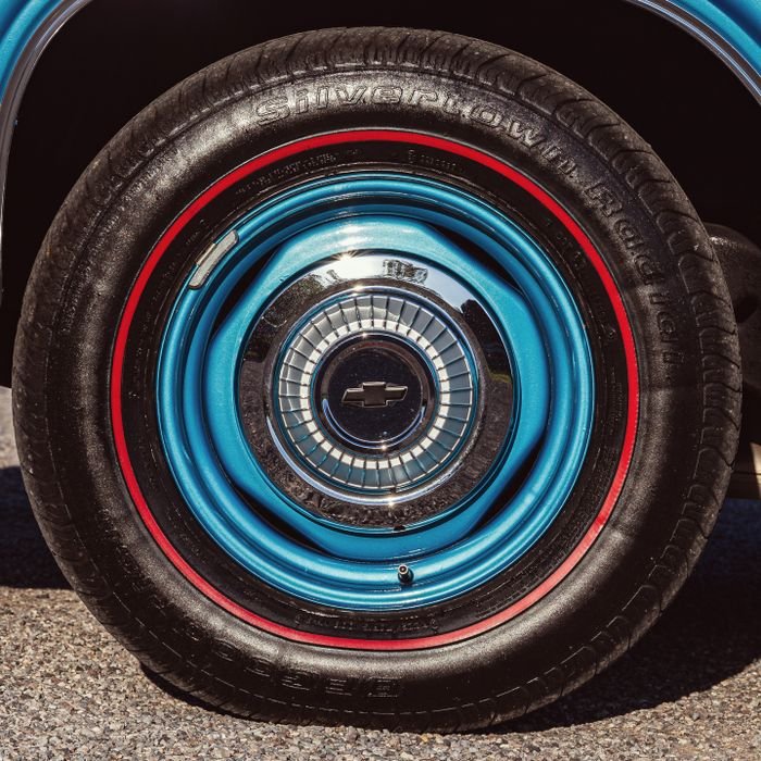 pexels photo 28355549 28355549 Detailed view of a classic 1966 Chevrolet Caprice wheel with distinctive blue design.