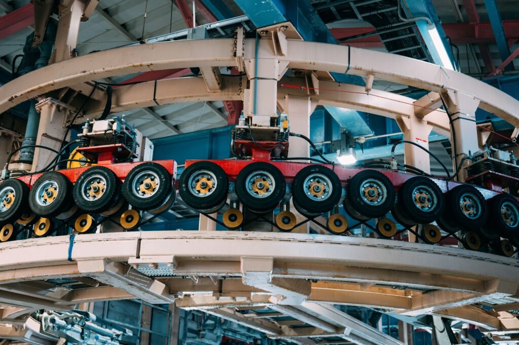 Close-up view of a complex industrial conveyor system inside a manufacturing facility.