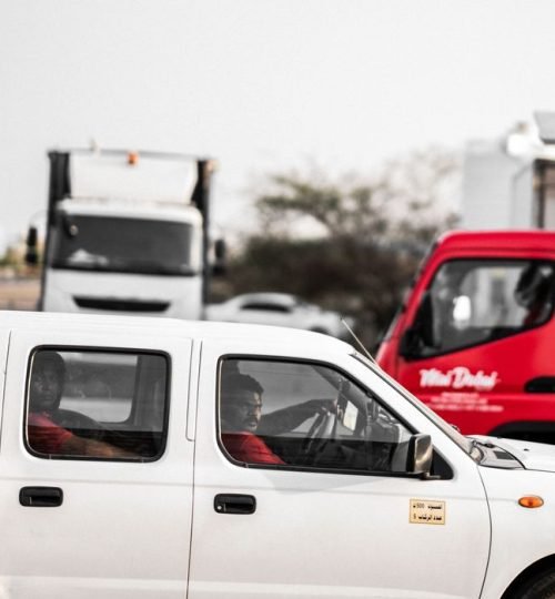 Why VTAR Captured scene of city traffic, highlighting cars and trucks in motion on a busy road.