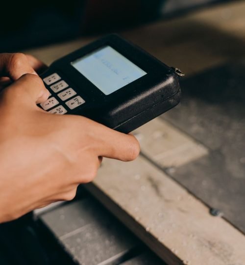Why VTAR A detailed close-up of hands operating an electronic control device, capturing the precision of modern technology use.
